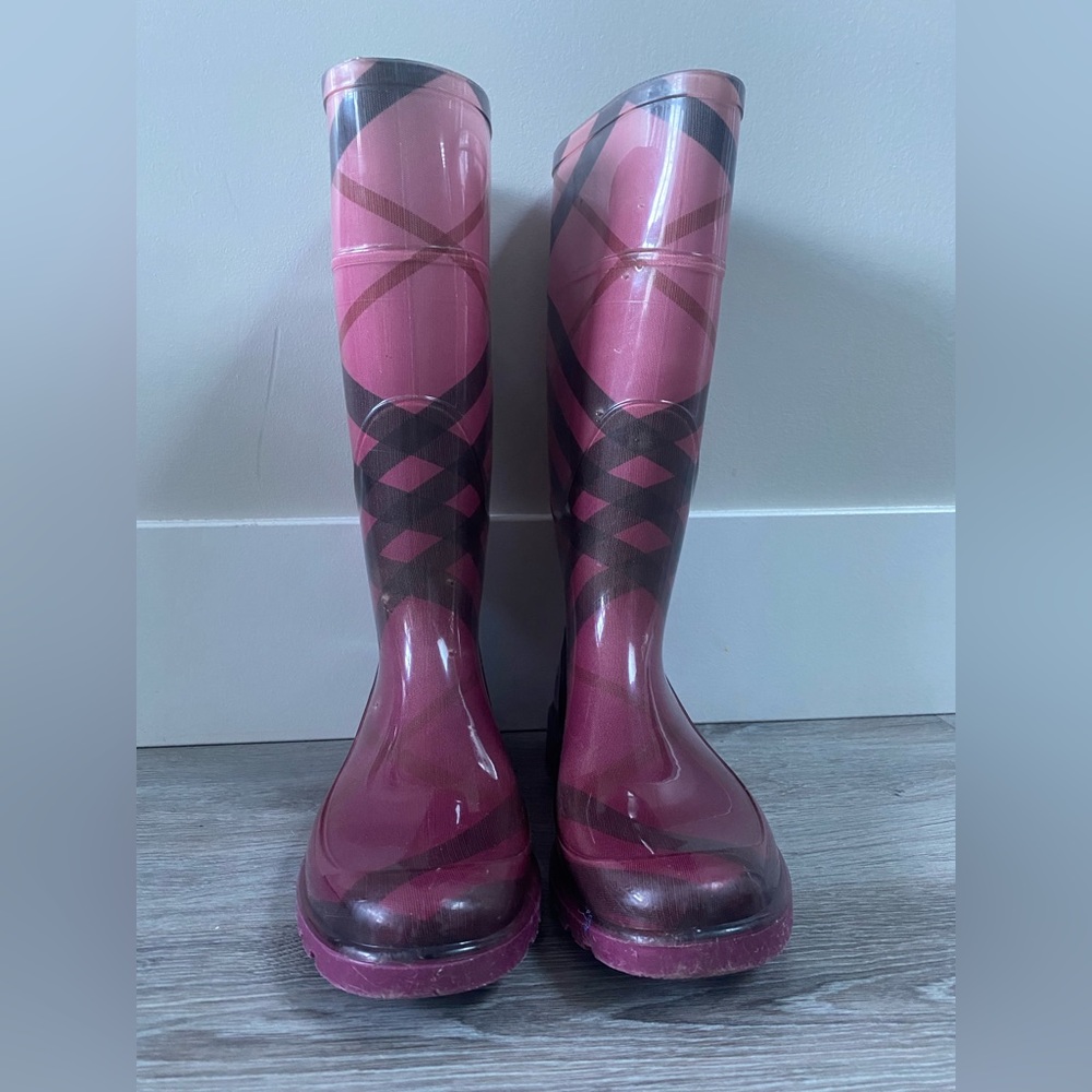 Burberry Fuchsia check rain boots.